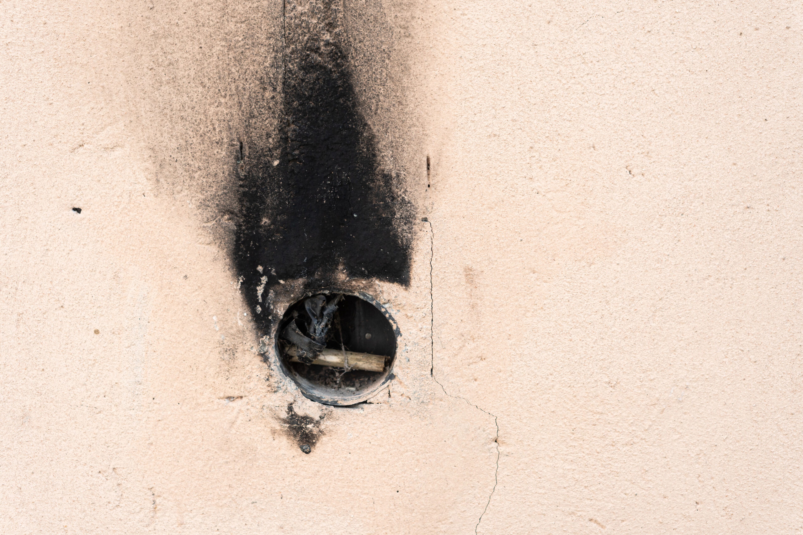 Depositphotos_778756852_XL Fire and smoke damaged wall